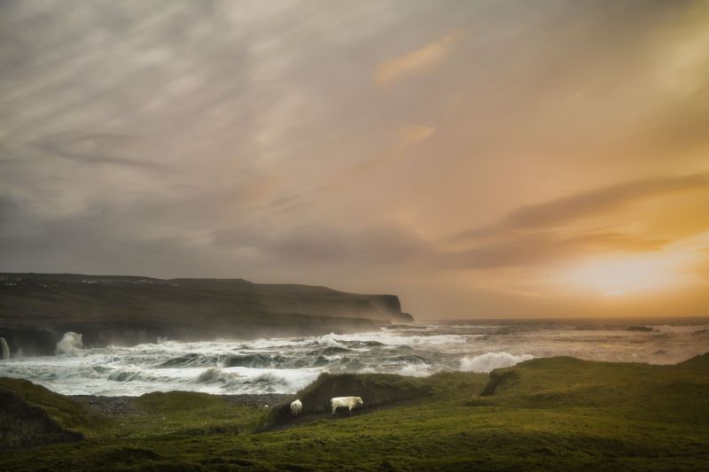 Sunset over a rough sea near Doolin's Pier